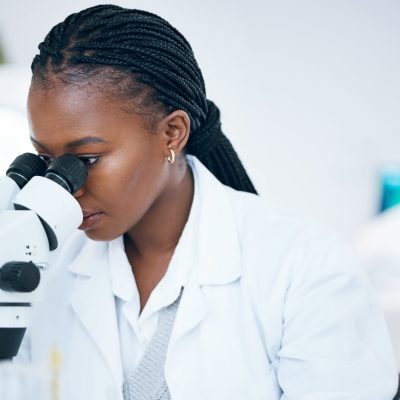 64bfc393d0b0fa429350daaa_medical-science-black-woman-and-microscope-in-lab-2023-02-25-00-47-43-utc-min